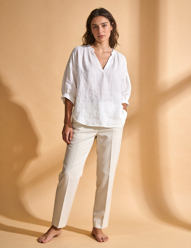 Woman wearing relaxed white linen blouse